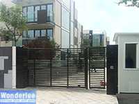 Slide gate with steel frame and wood infill