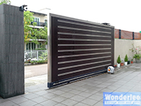 Automatic slide gate, wood with stainless steel trim