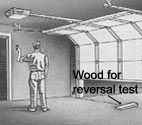 garage door opener reversal test with a thick piece of wood